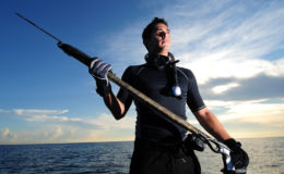 Young man with spear fishing