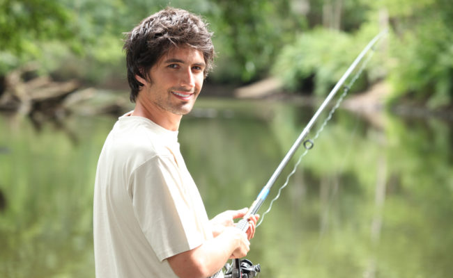 Man fishing on a river